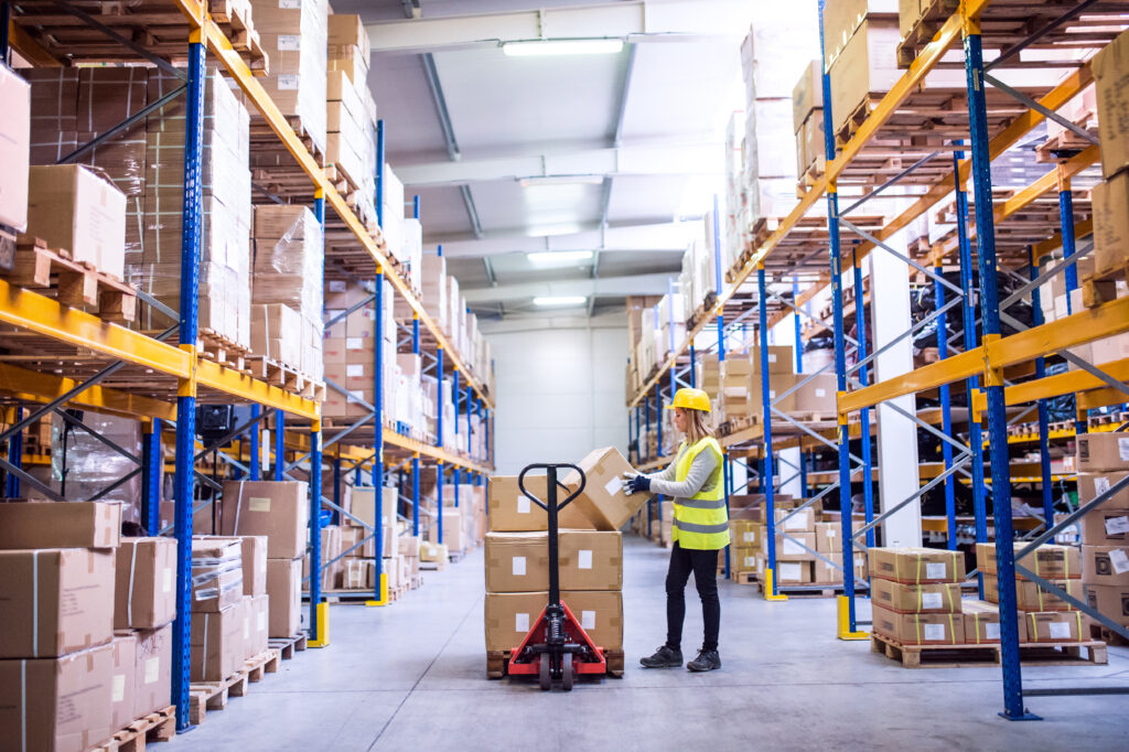 Female warehouse worker in a manual warehouse
