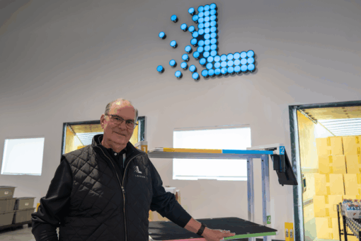 Man with a Locus Vector robot in a warehouse