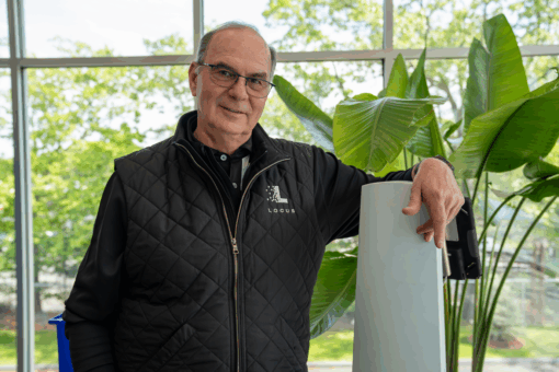 Rick with an Origin bot in front of a plant