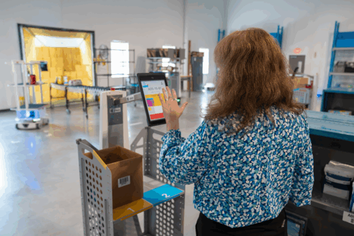 Woman interacting with Locus Origin to make a pick
