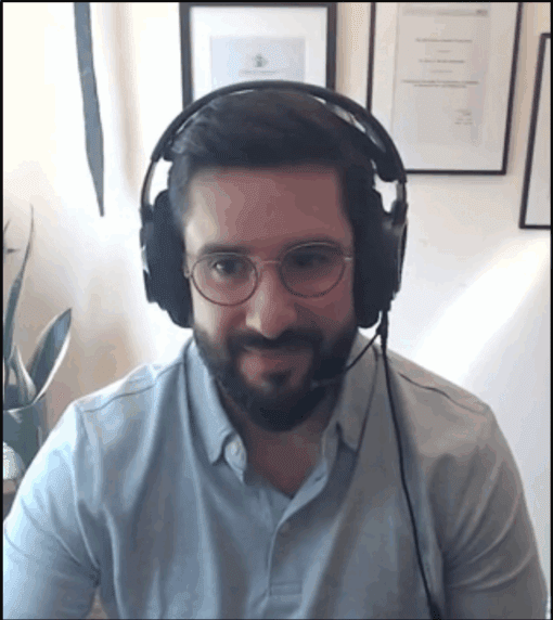 Man with a beard wearing headphones
