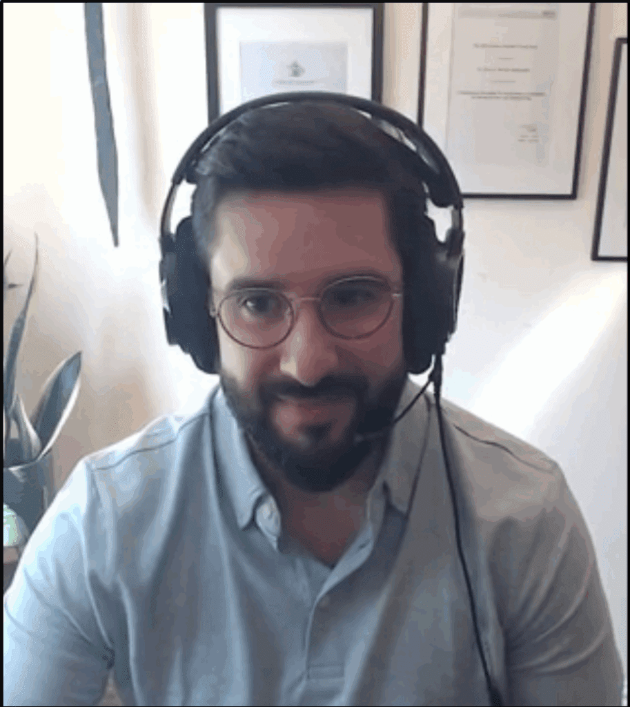 Man with a beard wearing headphones